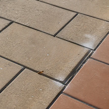Sound concrete pavers and tile patio surface