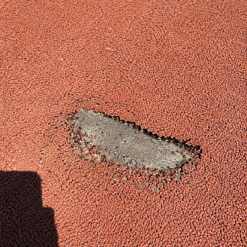 Poured surface torn open by something dragged across it